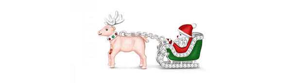 silver Santa, sitting in an elaborate sleigh which is drawn by a beautiful reindeer